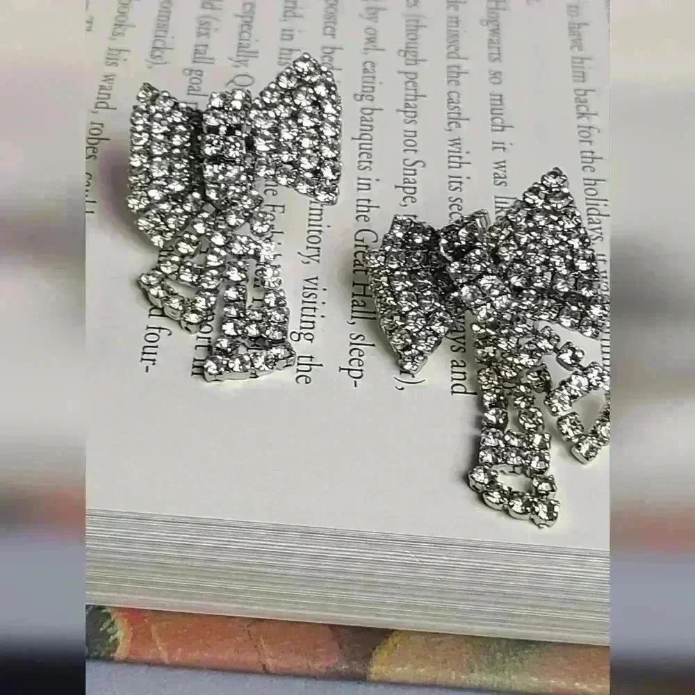 Silver tone clear rhinestones bow earrings - Picture 10 of 17